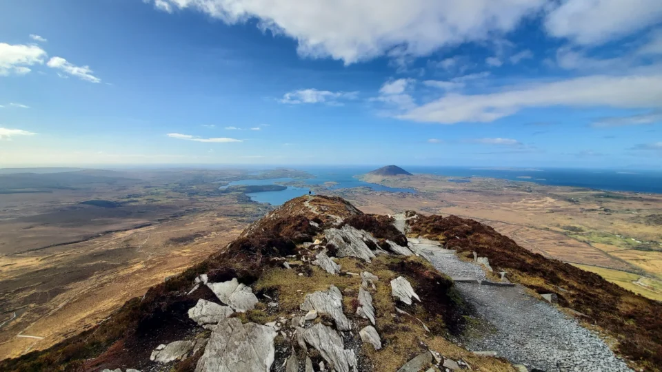 Scenic mountain view with clear skies and serene lake, perfect for hiking and relaxation. Ideal for nature lovers.